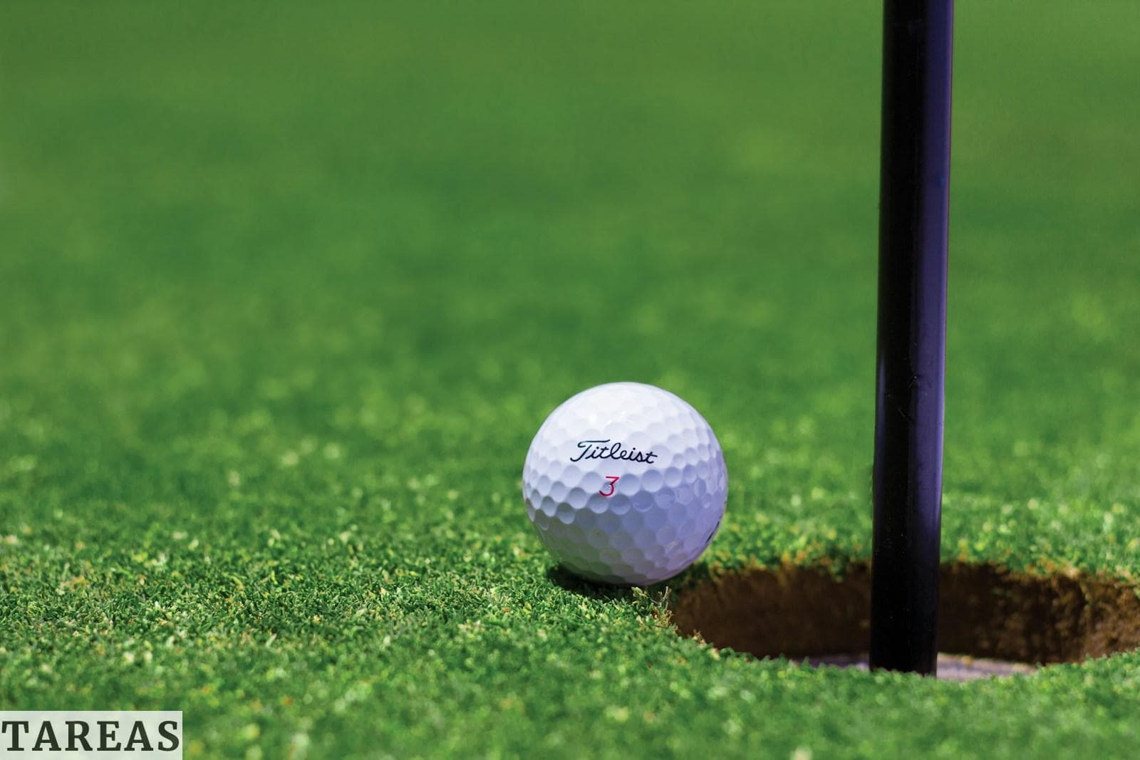 white golf ball on green grass field during daytime
